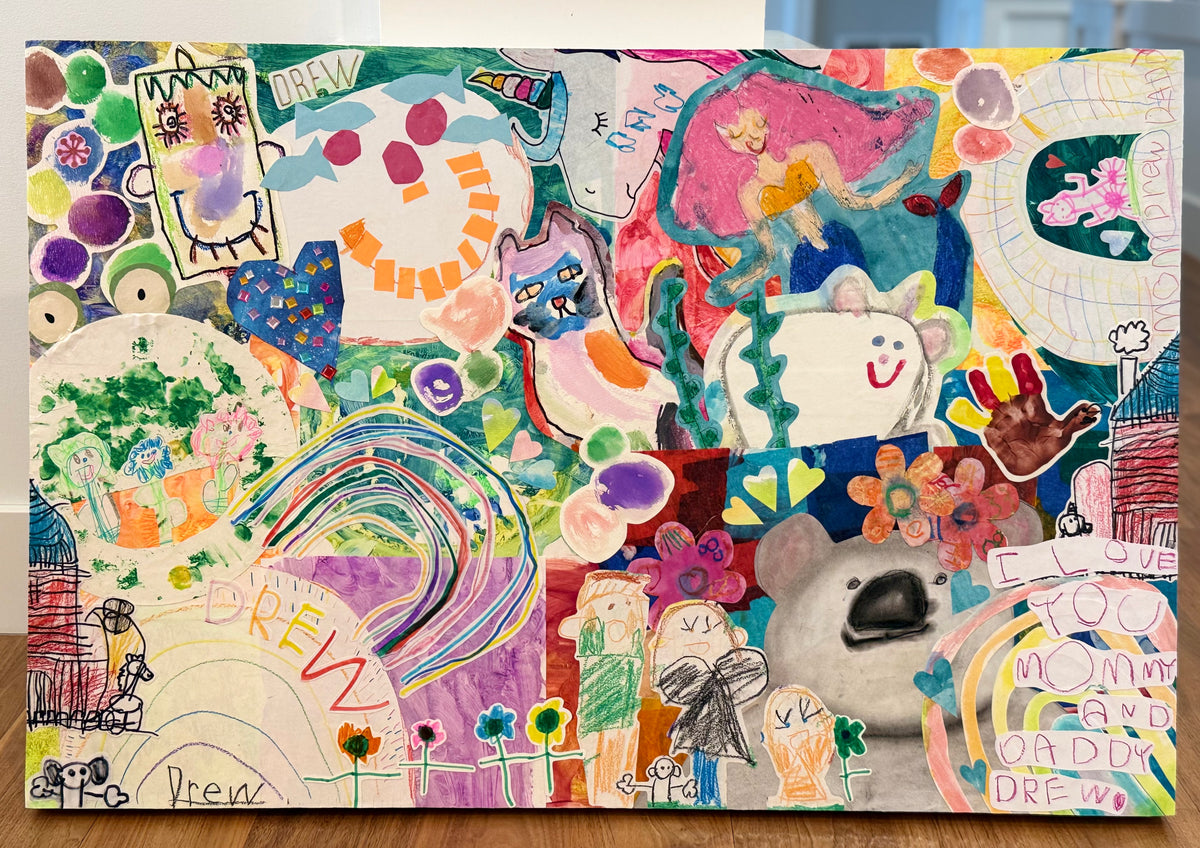 A finished custom collage laid flat: a child's colorful paintings, drawings, and handwriting pieced together edge to edge on a basswood panel.
